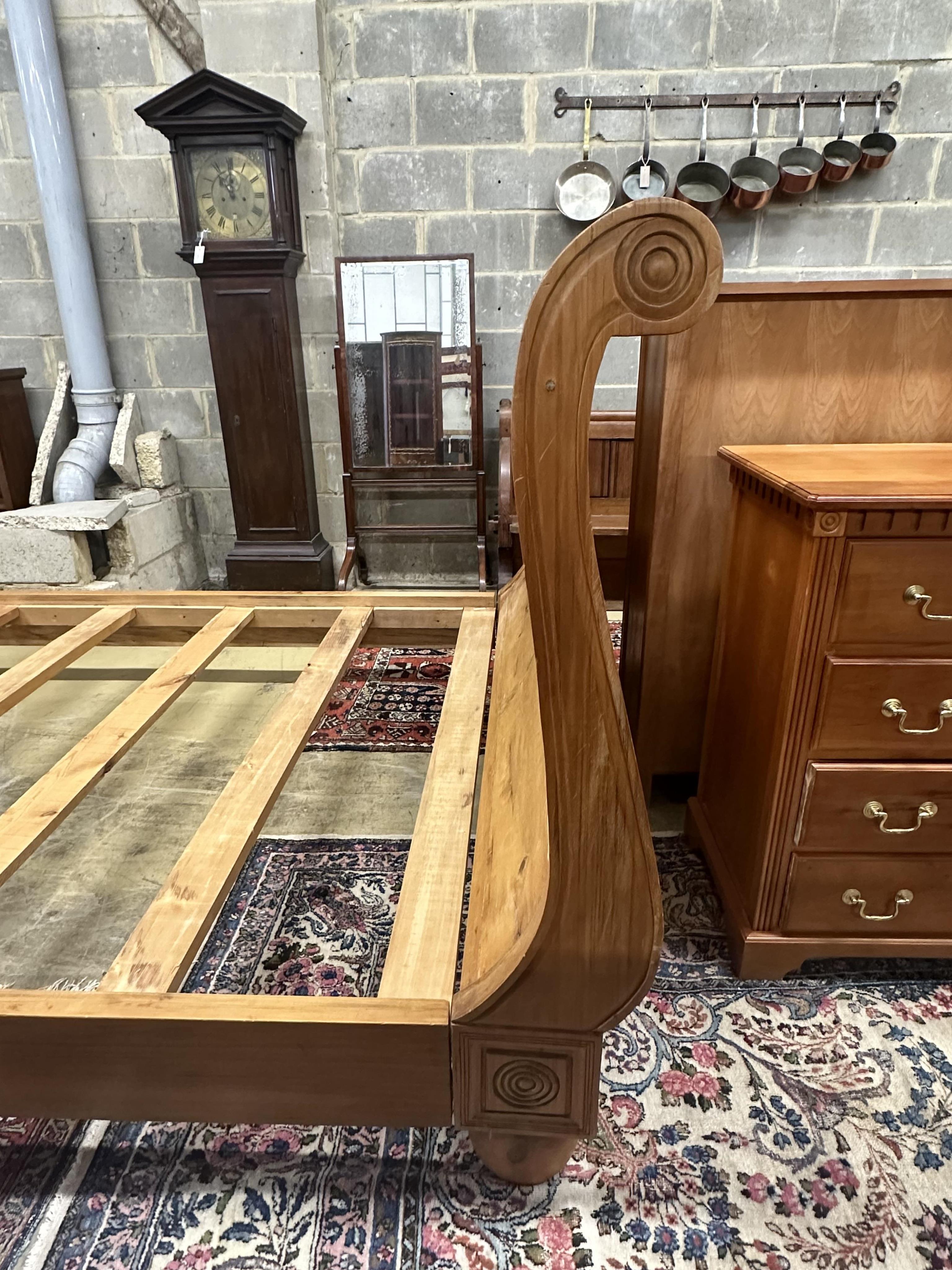 A Continental pine sleigh bed, width 164cm, length 250cm, height 120cm. Condition - poor-fair